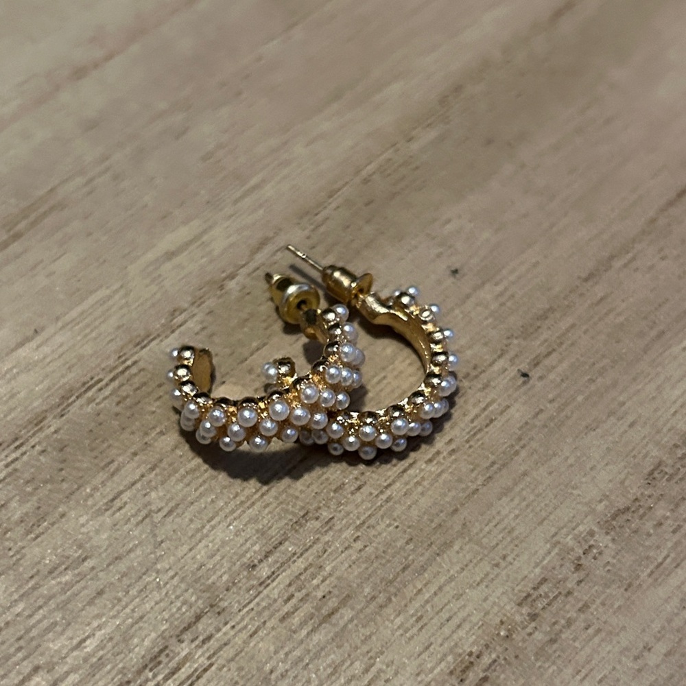 Gold hoop earrings covered in pearls